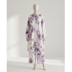 Mannequin wearing a white and purple floral Irish linen co-ord set with a long-line button-down shirt and matching wide-leg pants.