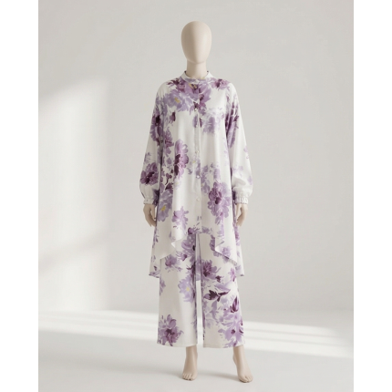 Mannequin wearing a white and purple floral Irish linen co-ord set with a long-line button-down shirt and matching wide-leg pants.