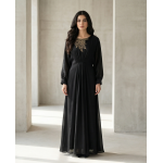 Woman modeling a two-piece coffee brown cotton lava kaftan set with a button-down collared shirt and matching floor-length skirt.