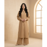 A woman modeling a camel-colored sheesha georgette co-ord set featuring a long tunic with quilted sleeves and matching wide-leg trousers.