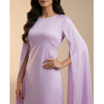 Woman wearing a dreamy lavender shamoos silk maxi dress with long split-sleeve cape details and a sophisticated boat neckline.
