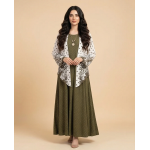 Woman modeling an olive green cotton jersey maxi dress with a white printed shrug featuring green floral and polka dot patterns.