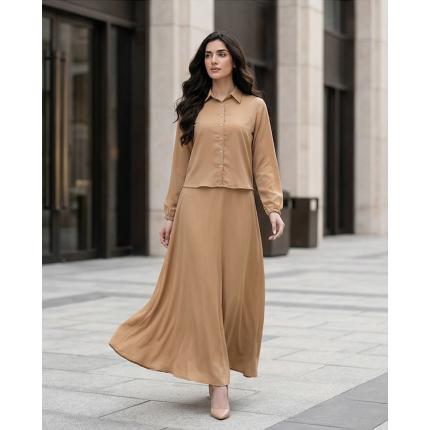 Woman wearing a long-sleeve camel-colored georgette maxi dress with a button-down collar and flowing floor-length skirt.