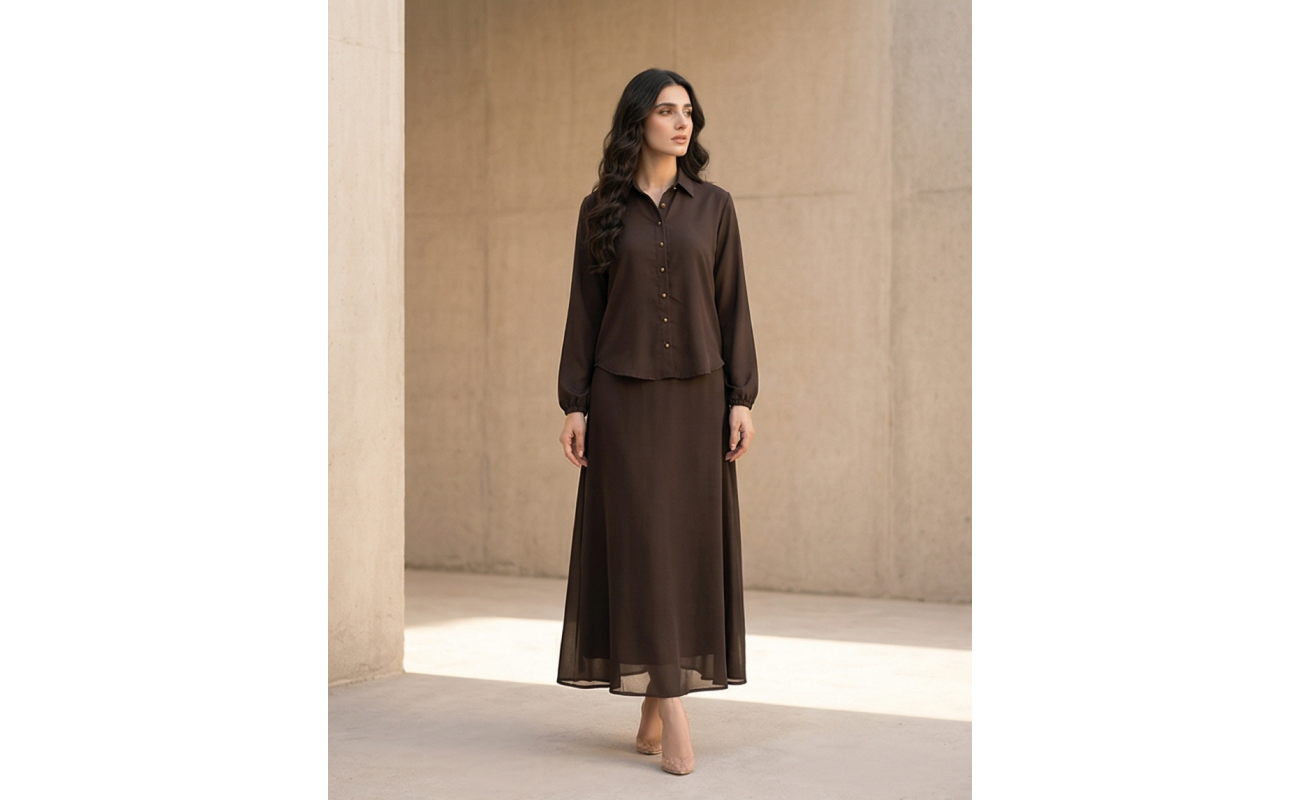 Woman modeling a long-sleeve espresso brown georgette maxi dress with a button-down collar and flowing skirt.