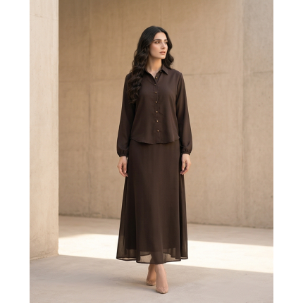 Woman modeling a long-sleeve espresso brown georgette maxi dress with a button-down collar and flowing skirt.