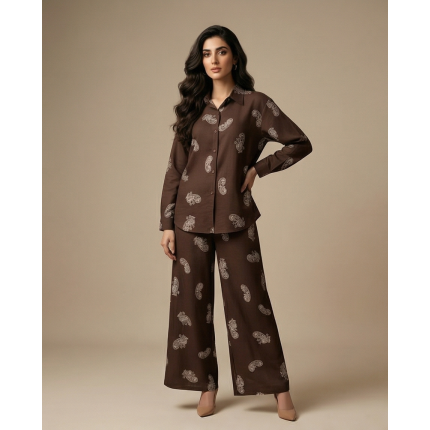 Woman wearing a white and grey paisley print Irish linen co-ords set with long sleeves