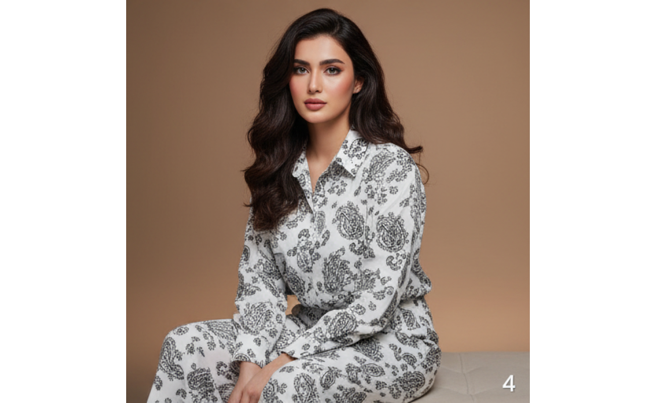 Woman wearing a white and grey paisley print Irish linen co-ord set with long sleeves.