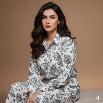 Woman wearing a white and grey paisley print Irish linen co-ord set with long sleeves.